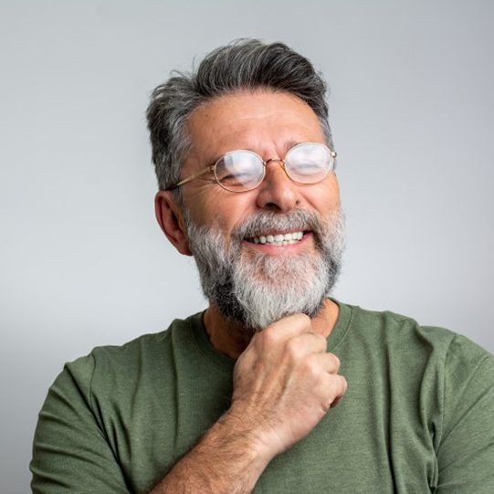 a man smiling with his all-on-4 dental implants