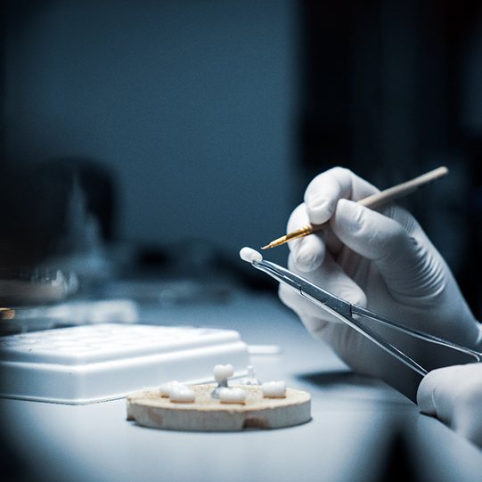 a dental lab technician making a crown