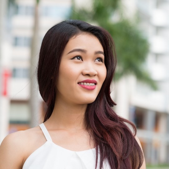 Smiling woman with braces in Mansfield