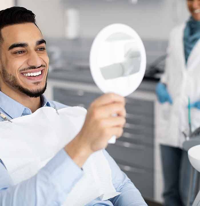 Dental tools set on a pile of money