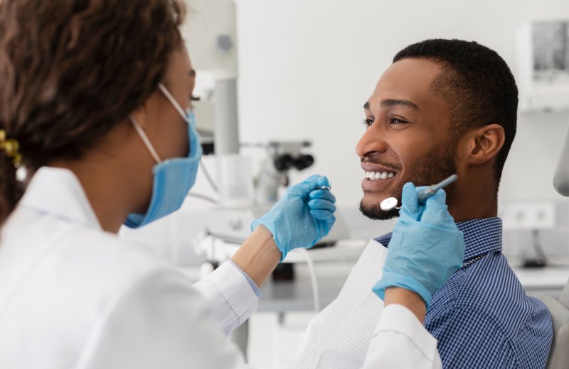 Patient smiling after cosmetic dentistry